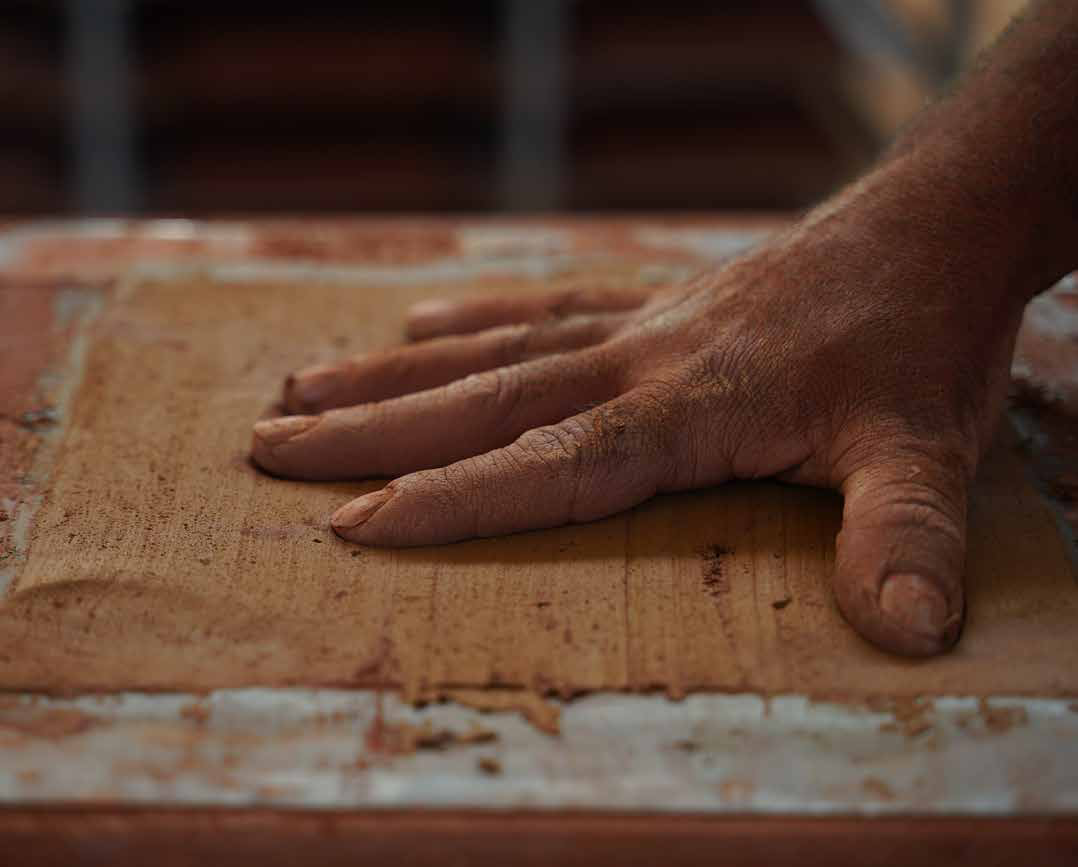 Sahtas artisan shaping handmade clay roof tiles, İzmir Türkiye