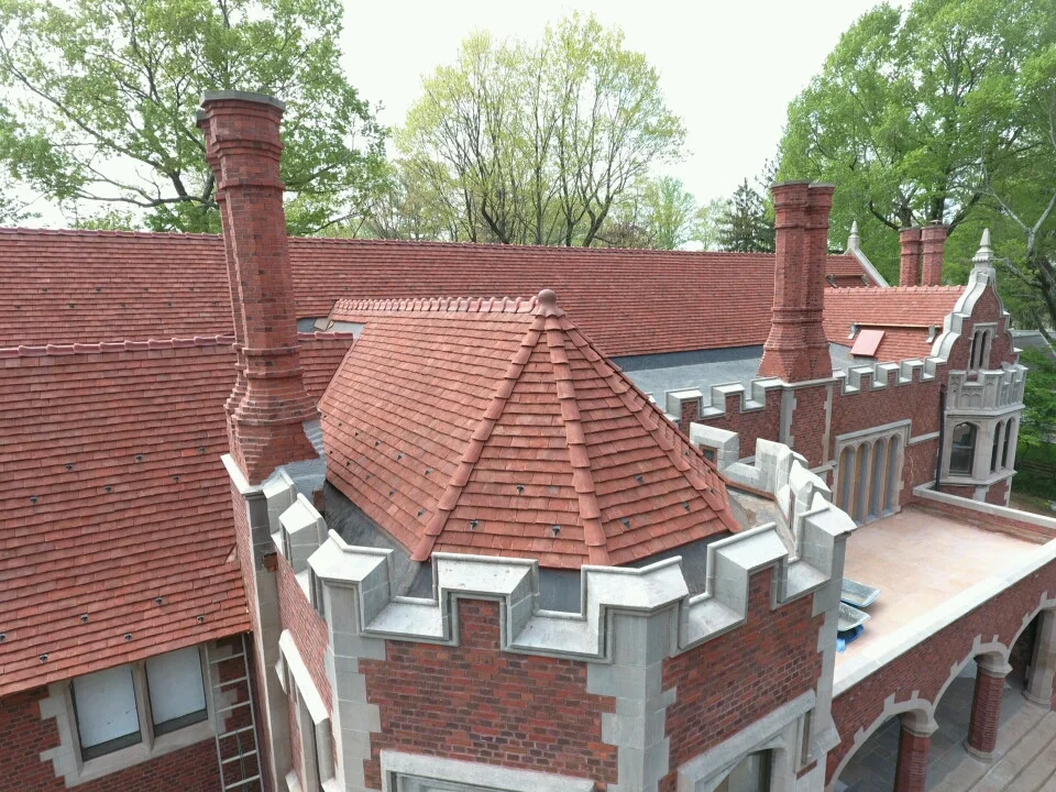 Handmade terracotta clay roof tiles on a luxury residence